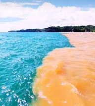 Viral Penampakan Air Pantai Baron Berwarna Cokelat dan Biru
